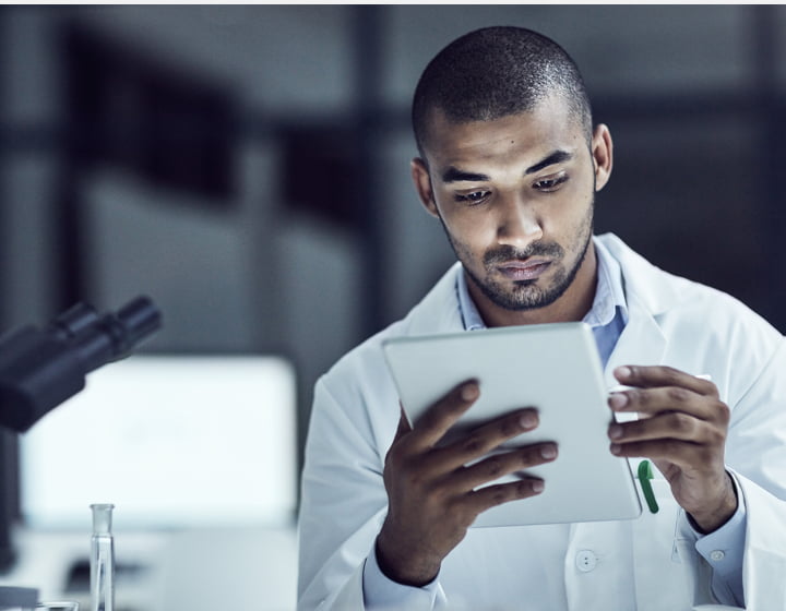 scientist reading a report in a laboratory